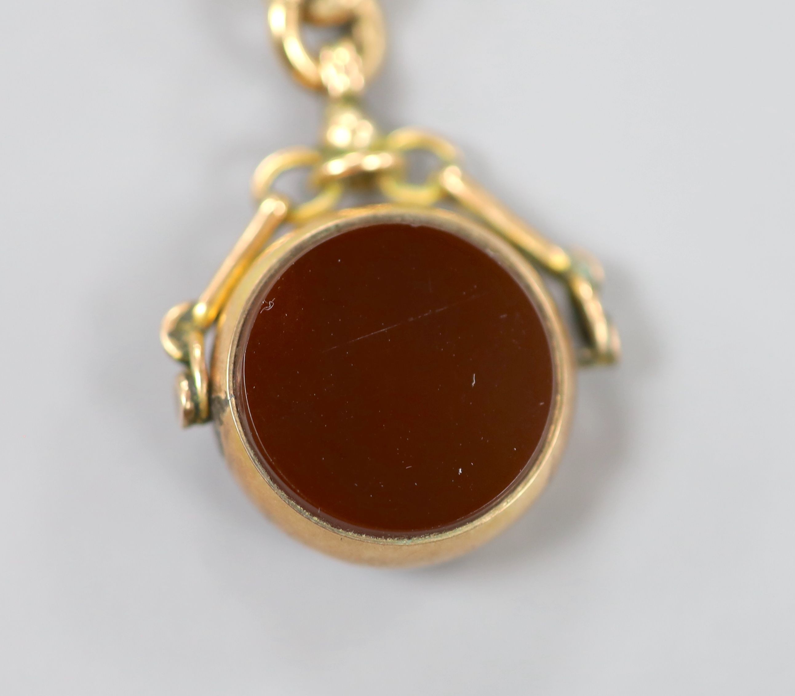 A 9ct gold watch albert, 30cm hung with a 9c, carnelian and bloodstone set spinning fob, gross weight 27.9 grams.